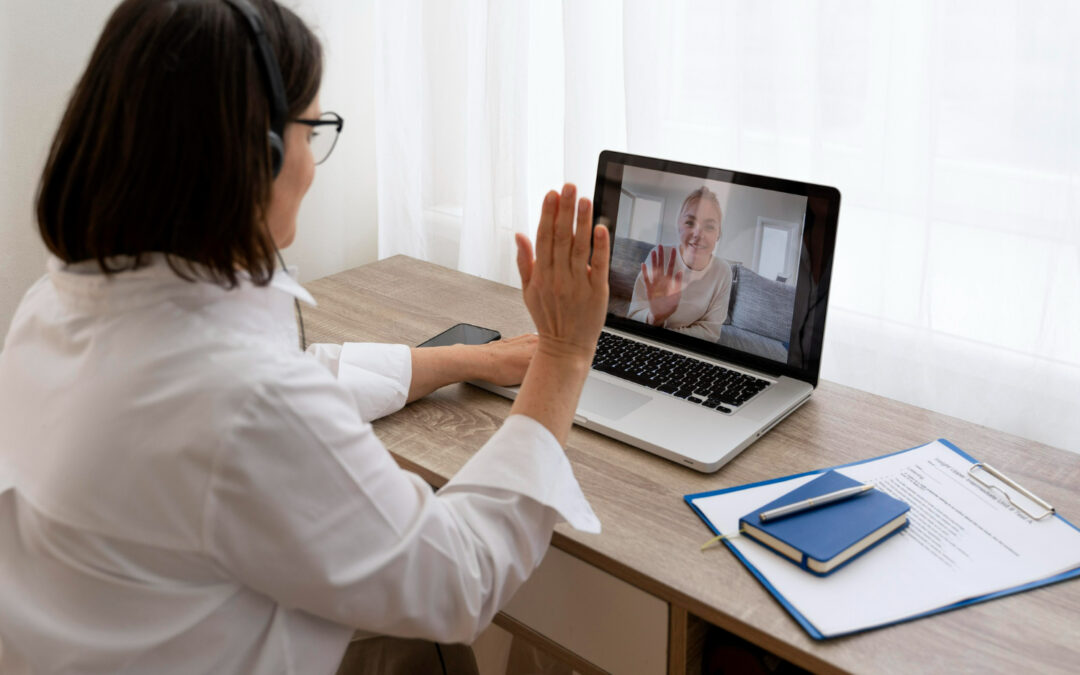 “Mental health provider conducting an online psychiatry session with a patient via video call on a laptop