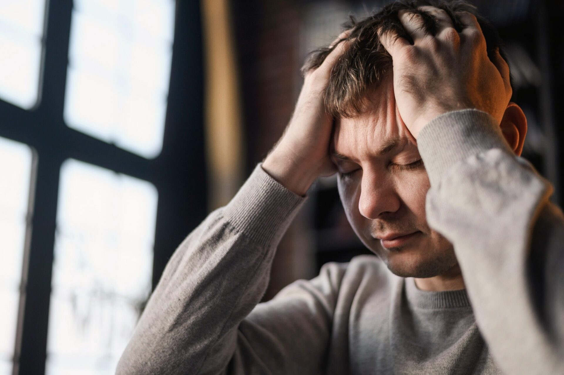 Man experiencing stress and difficulty concentrating due to depression Man experiencing stress and difficulty concentrating due to depression